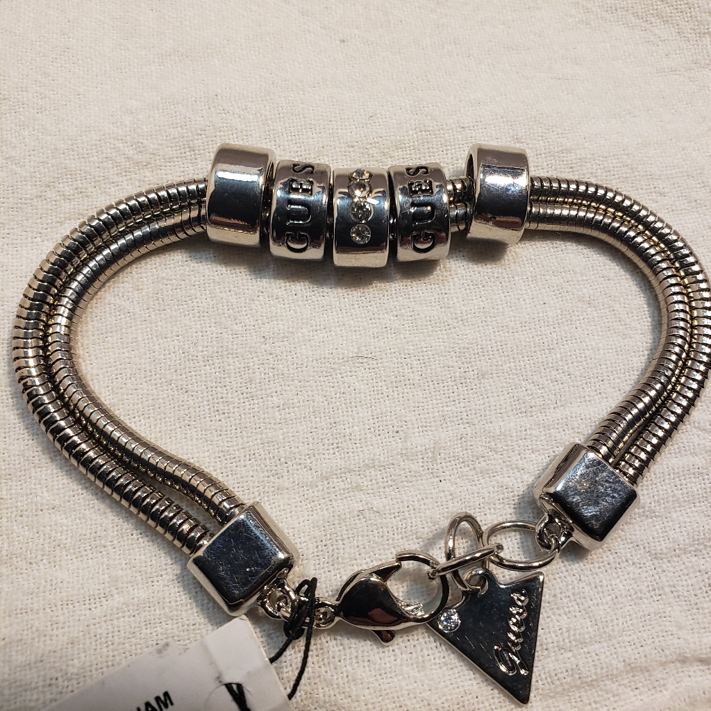 Guess Silvertone Bracelet With Tag And Guess On The 2 Beads 12$